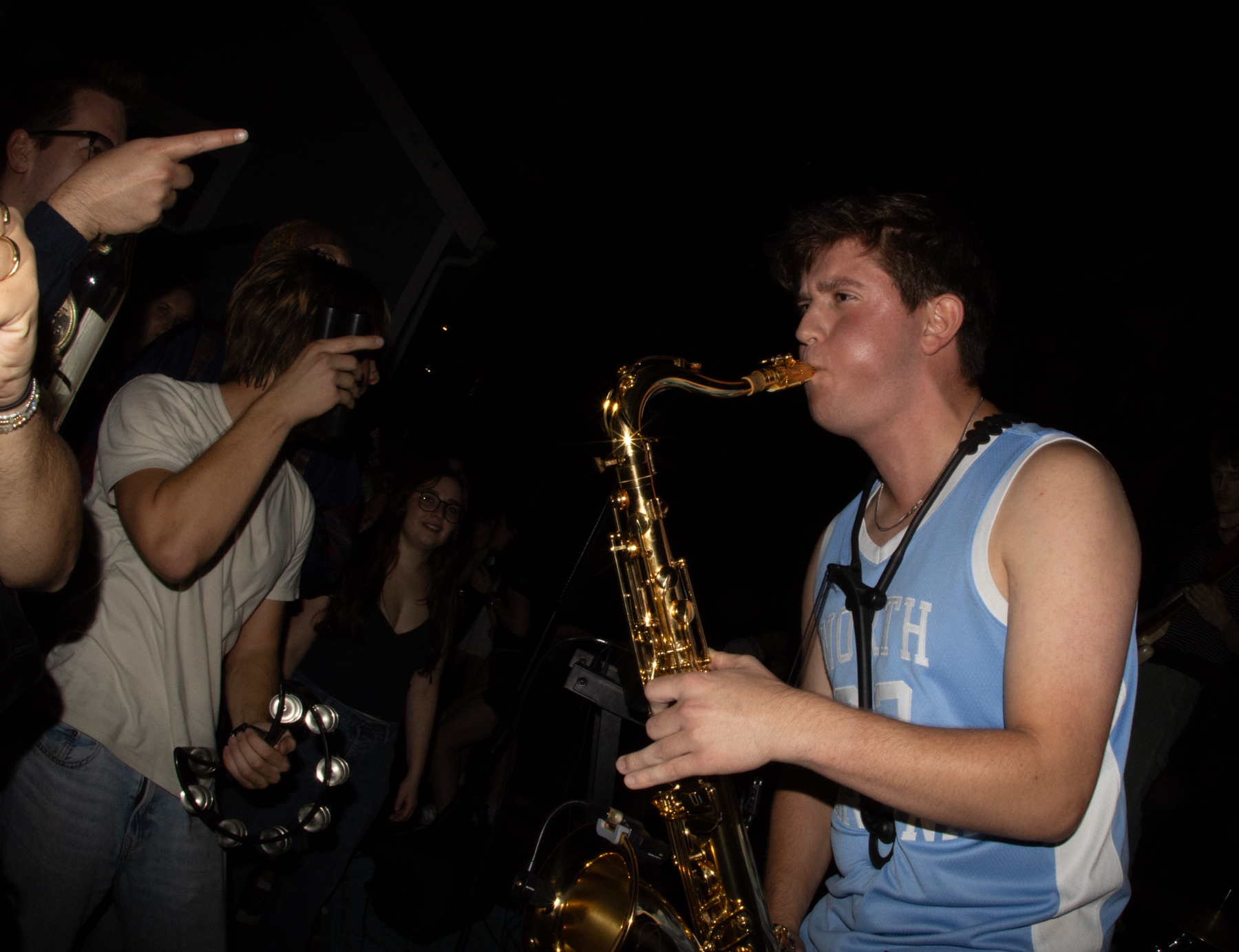 photo of Damian Calvo playing the saxophone with his band, Red Kanoo.